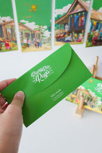 Load image into Gallery viewer, Loka Made brings to life the celebratory times of Hari Raya in the heart of Kampung through an illustration entitled 'Riang Ria Raya'. At its core, this beautiful place captures the essence of family togetherness, reflecting the cherished traditions and joyous times we share without loved ones during the festive season. 5 different designs in a set.